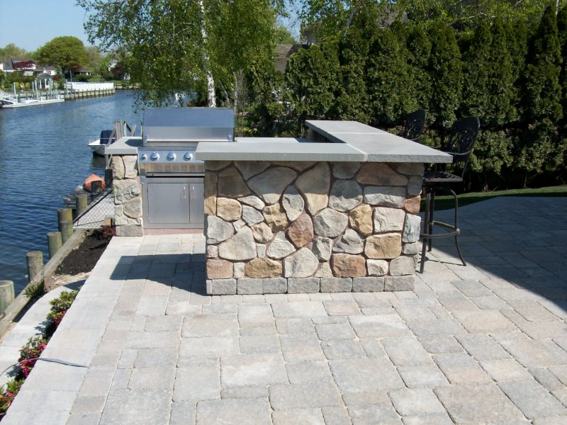 waterfront house with outdoor bar patio